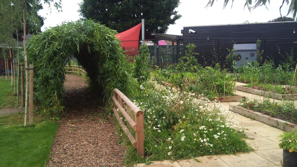 View of green tunnel and kitchen garden